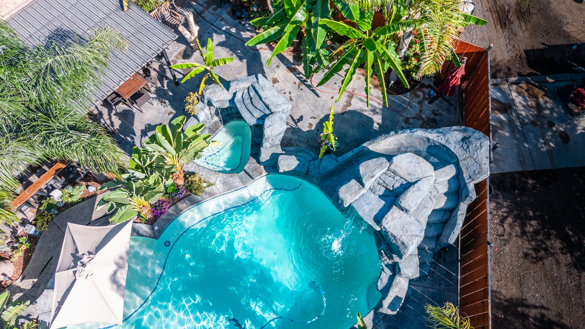 Pool with attached spa built by Neighborhood Pool Service