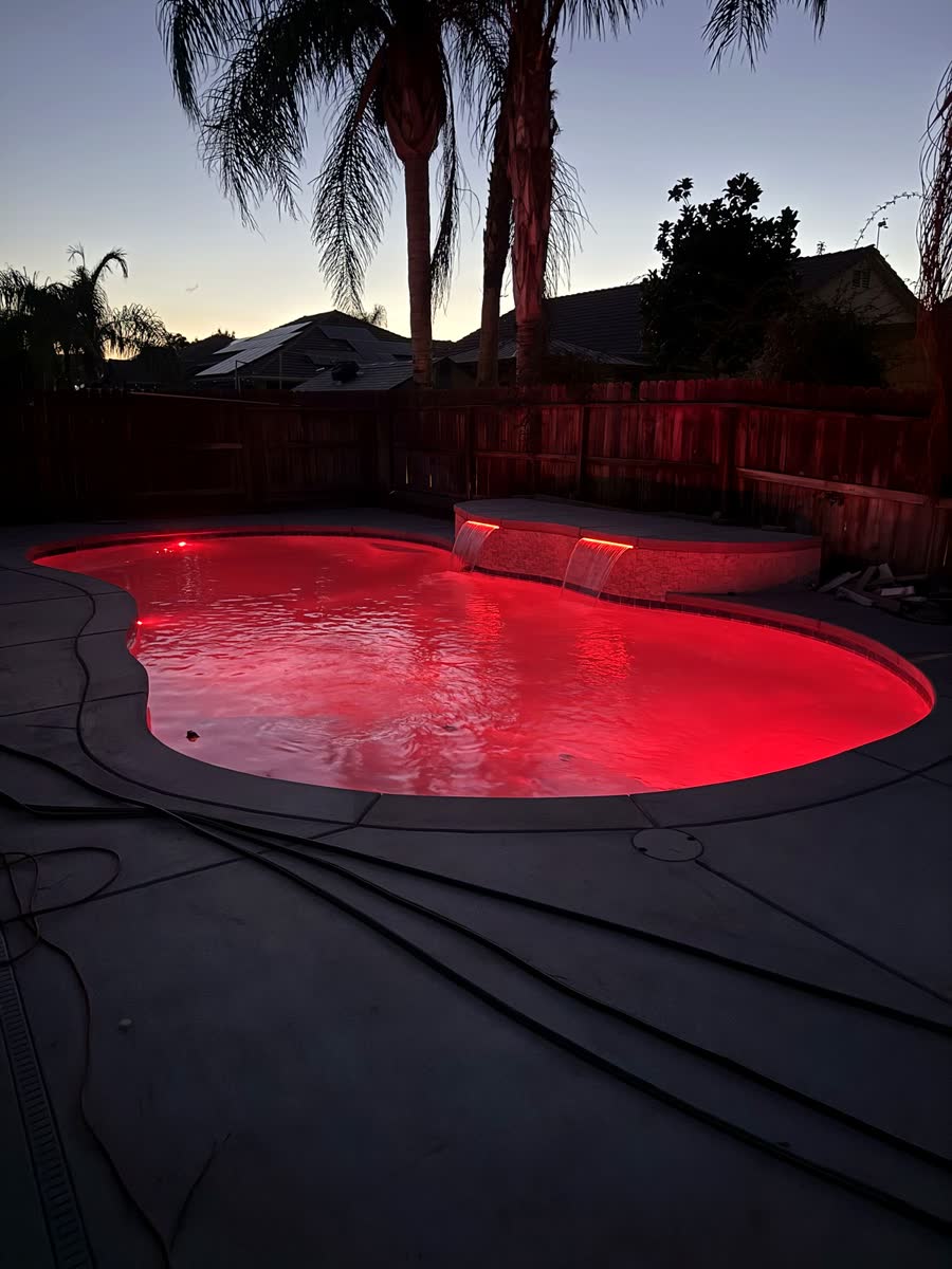 Night — Red LED — pool built by Neighborhood Pool Service