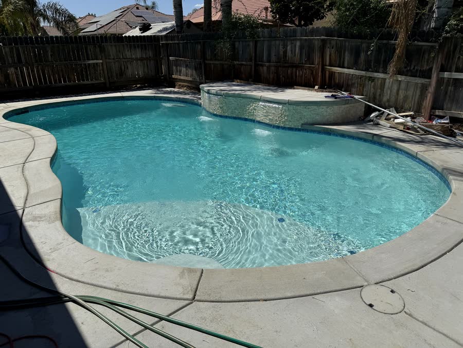 Freeform + Spa — pool built by Neighborhood Pool Service