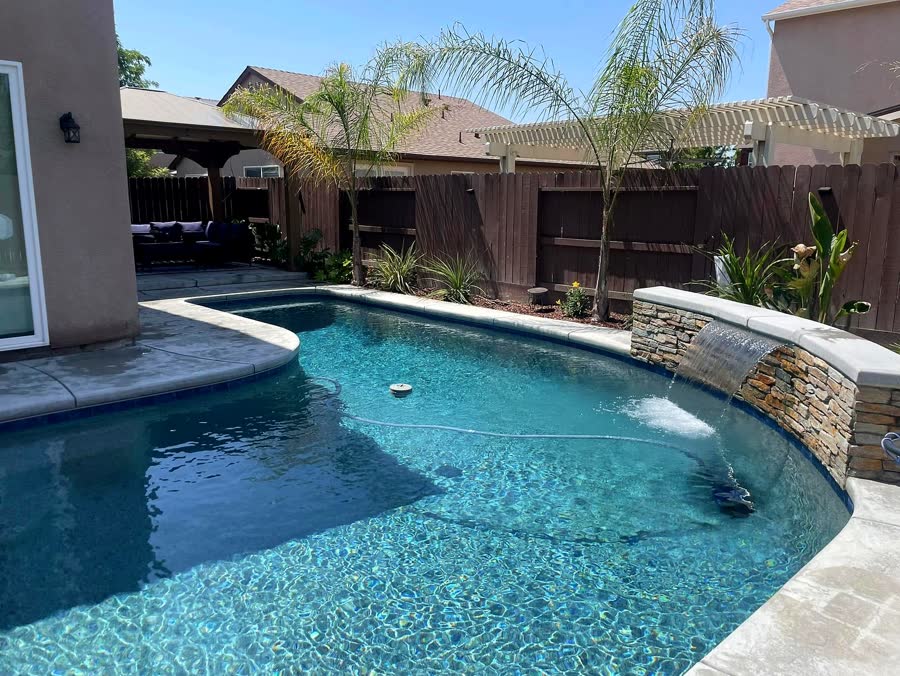 Stone Waterfall — pool built by Neighborhood Pool Service