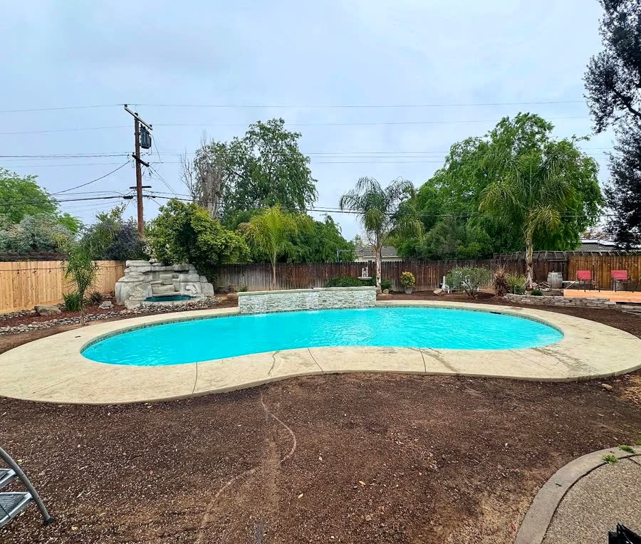Freeform + Tiled Coping — pool built by Neighborhood Pool Service