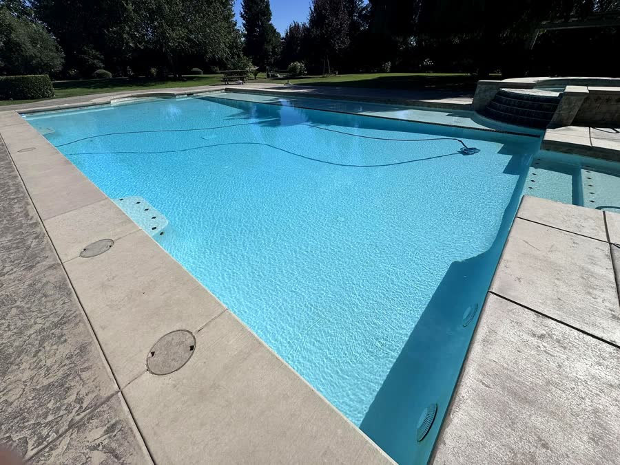 Kidney + Rock Feature — pool built by Neighborhood Pool Service