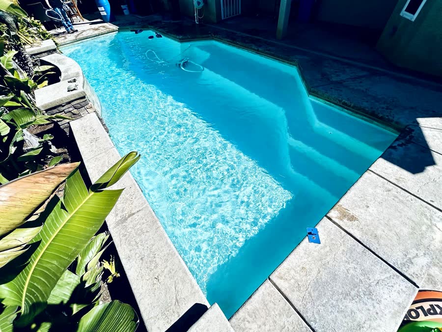 Rect. + Stone Waterfall — pool built by Neighborhood Pool Service