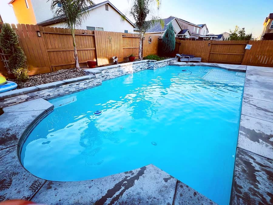 Geo + Tropical Surround — pool built by Neighborhood Pool Service