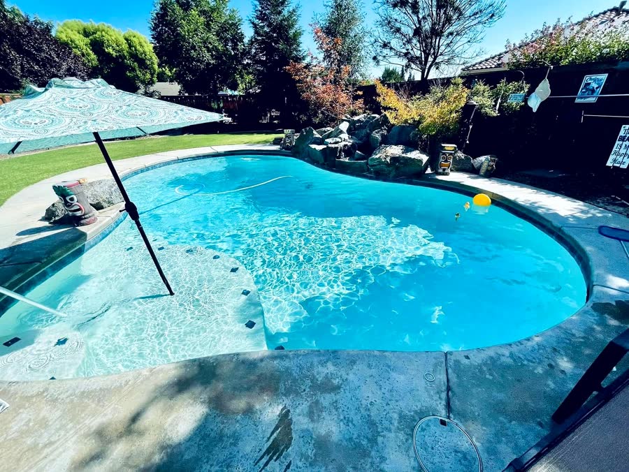 Freeform + Spa + Pergola — pool built by Neighborhood Pool Service